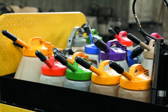 Sealable and reusable lubricant transfer containers that are color coded to avoid lubricant mixing